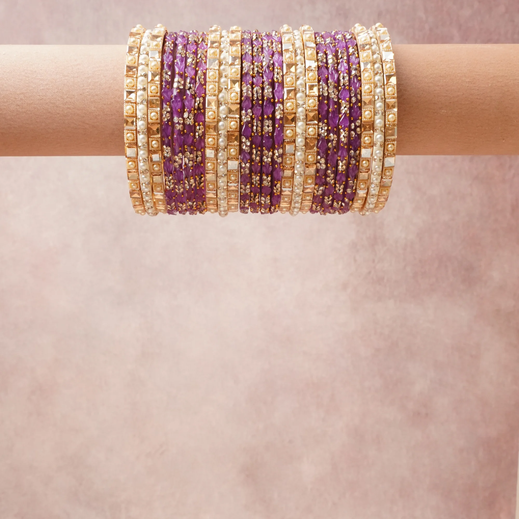 A grounding Purple forms the heart of the set, while touches of Ivory, Antique Gold, Clear add charm.

A thoughtful composition of Glass/Resin, Simulated Pearl, Gold-toned Metal, Crystal/Rhinestone, designed to feel complete without being heavy.
Each element layers seamlessly, creating a look that is refined, wearable and quietly striking.